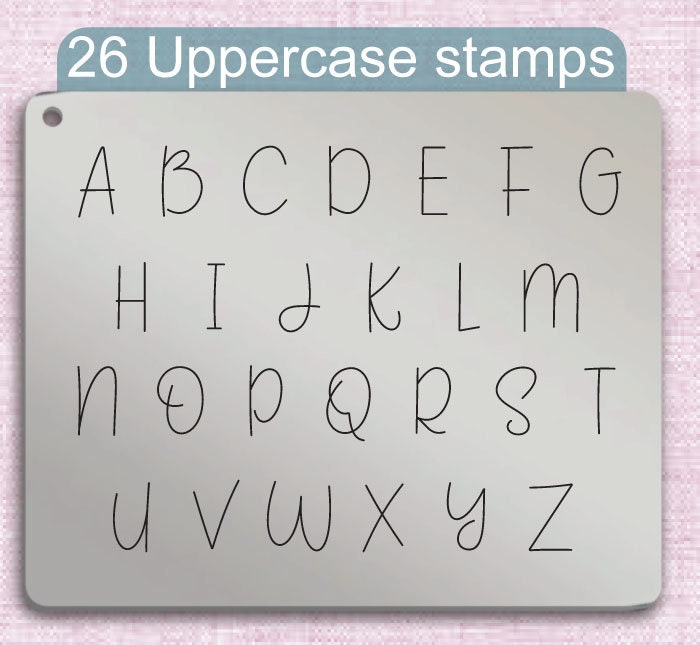 说可爱的金属字母邮票，完整的字母。